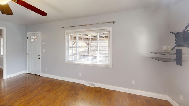 interior space with wood-type flooring and ceiling fan