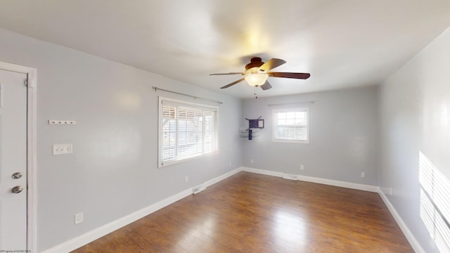 spare room featuring hardwood / wood-style floors and ceiling fan