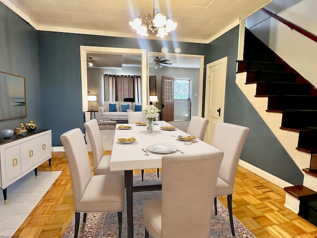 dining area with crown molding, light parquet floors, and ceiling fan with notable chandelier