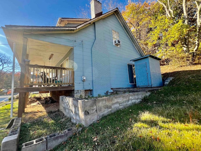 back of house with a yard and cooling unit