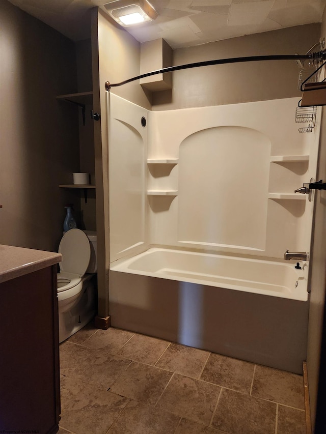 full bathroom featuring vanity, washtub / shower combination, and toilet