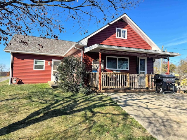 view of front of home with a front lawn and a porch