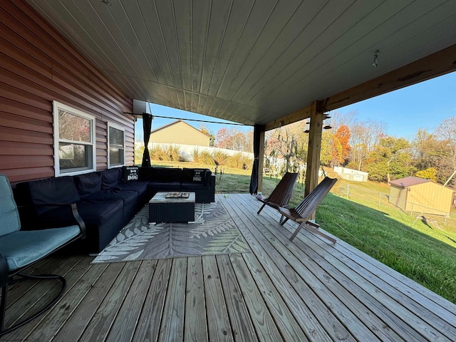 deck with a lawn and an outdoor living space