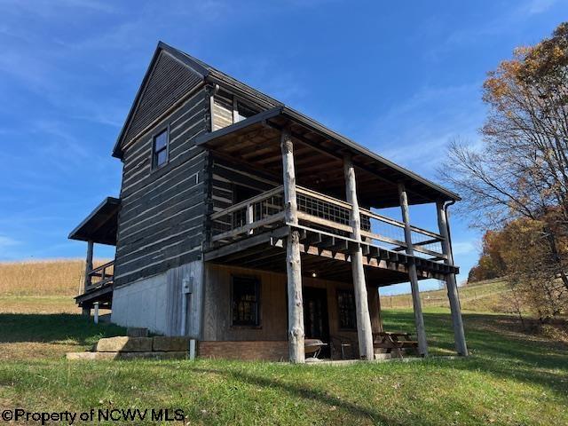 12275 Route 20 S Road, Rock Cave, WV 26234 - back of property featuring a deck and a yard
