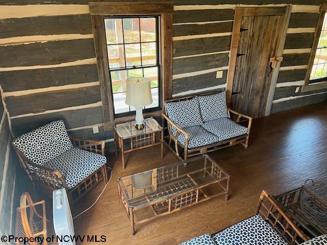 12275 Route 20 S Road, Rock Cave, WV 26234 - sitting room featuring wood finished floors and wood walls
