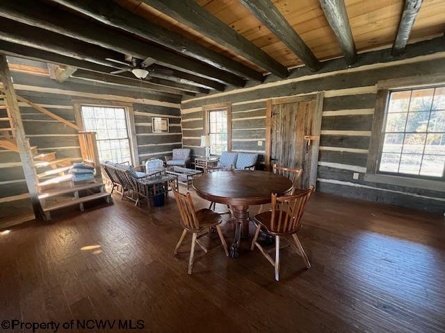 12275 Route 20 S Road, Rock Cave, WV 26234 - dining space featuring wood walls, beam ceiling, wood-type flooring, and ceiling fan