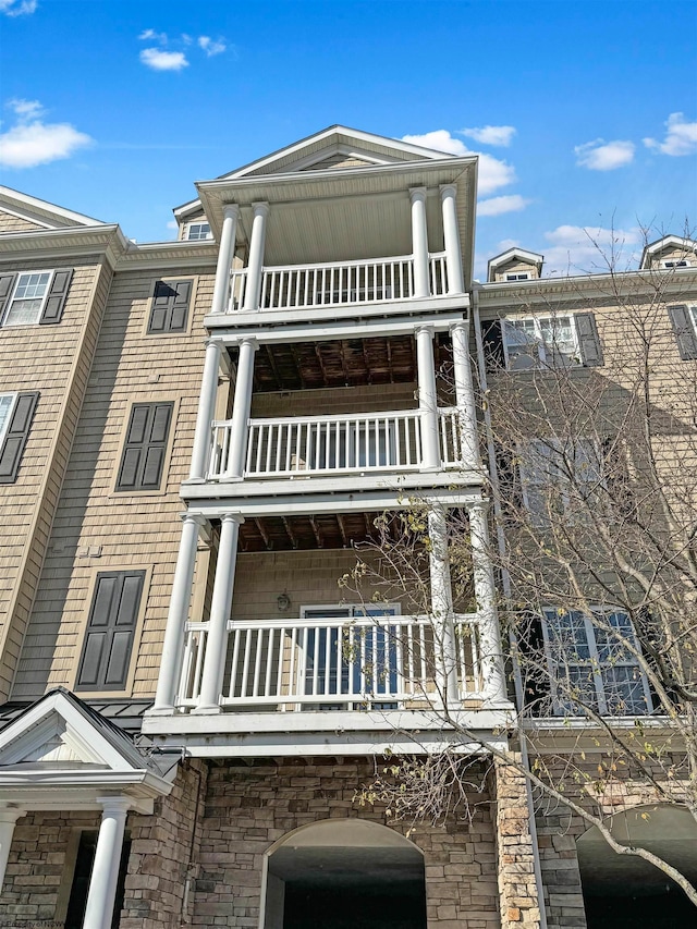 view of front of house with a balcony