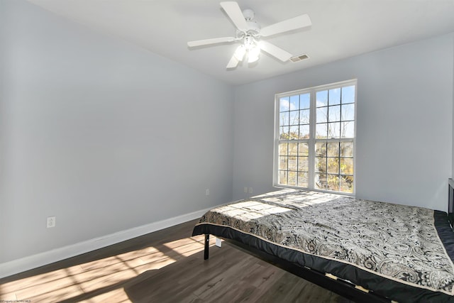 bedroom featuring hardwood / wood-style flooring and ceiling fan