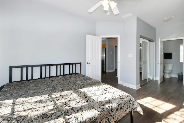 bedroom with dark hardwood / wood-style flooring, connected bathroom, and ceiling fan