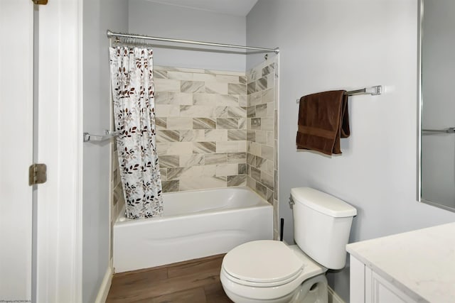 full bathroom with vanity, hardwood / wood-style floors, shower / bath combo, and toilet