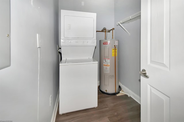 clothes washing area with electric water heater, stacked washer and dryer, and hardwood / wood-style floors