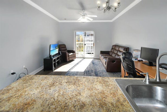 home office with crown molding, sink, and ceiling fan with notable chandelier