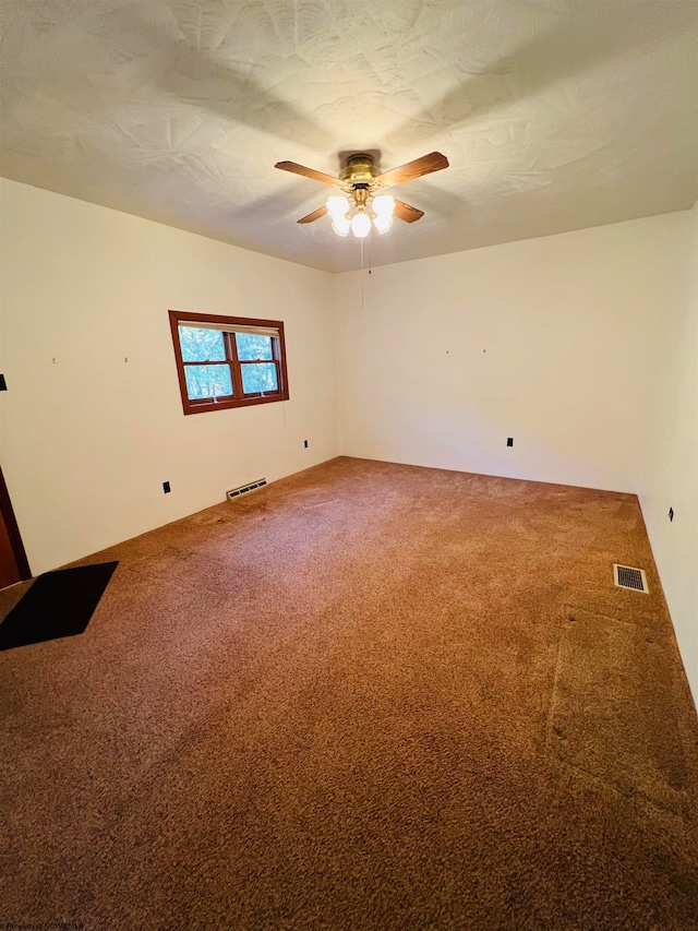 carpeted empty room with ceiling fan