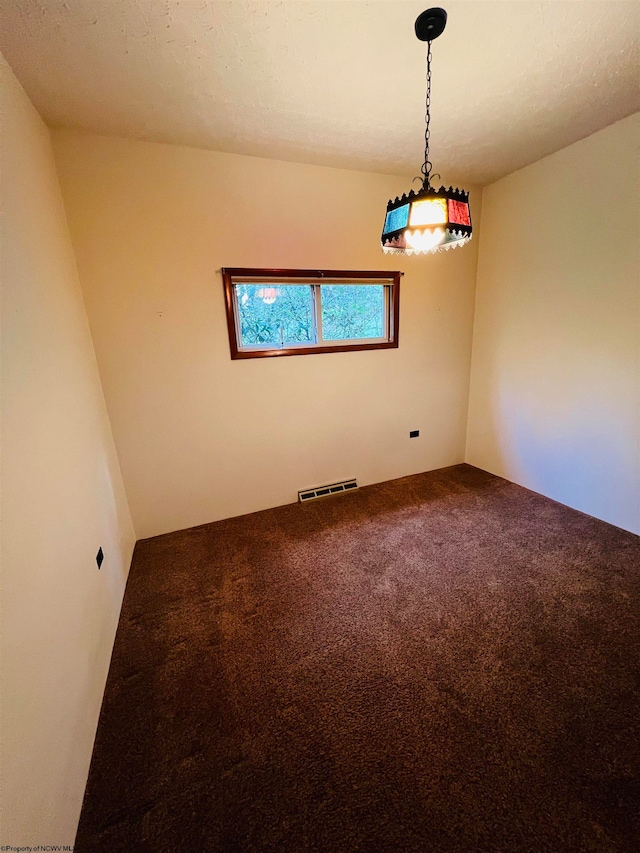 spare room featuring carpet floors