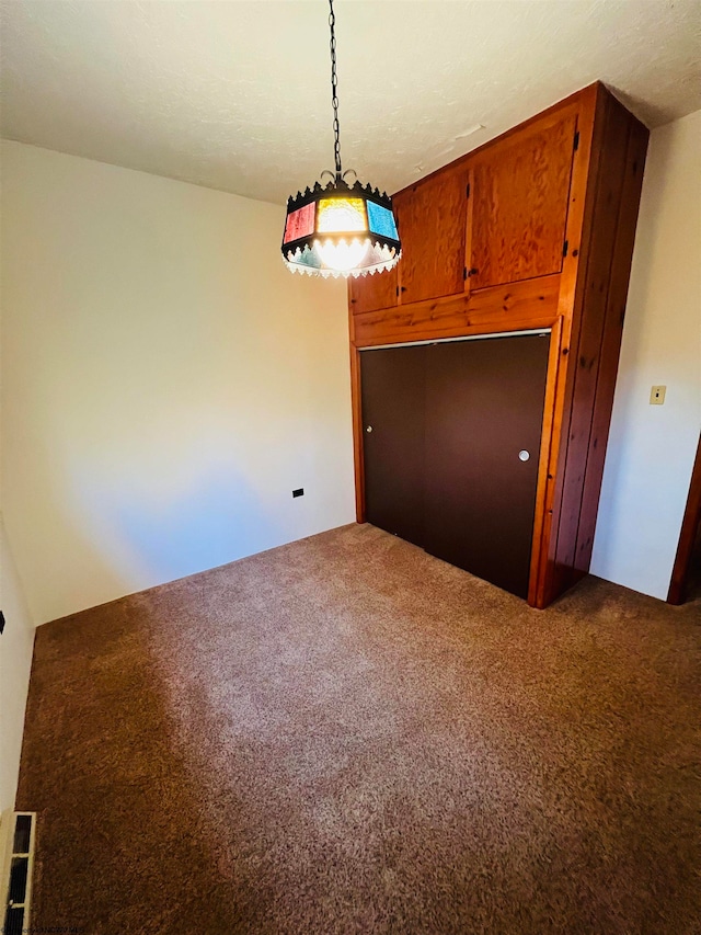 unfurnished dining area with carpet floors