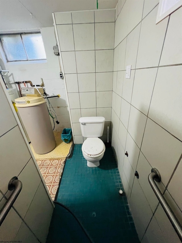 bathroom with toilet, tile walls, and tile patterned flooring