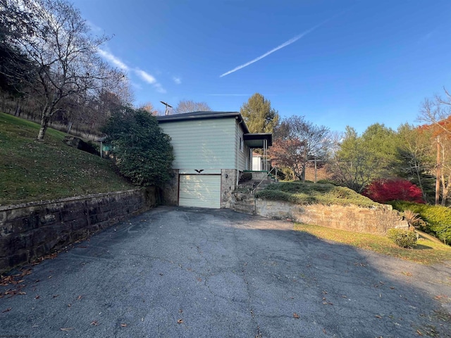 view of property exterior featuring a garage