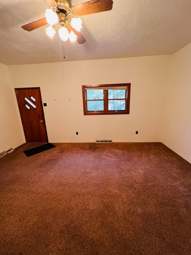 interior space with ceiling fan