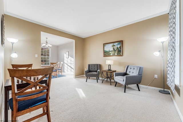 sitting room featuring crown molding, carpet flooring, and an inviting chandelier