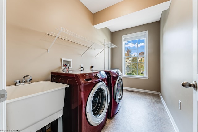 laundry room featuring sink and independent washer and dryer