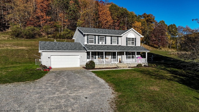 view of front facade featuring covered porch, a front lawn, and a garage