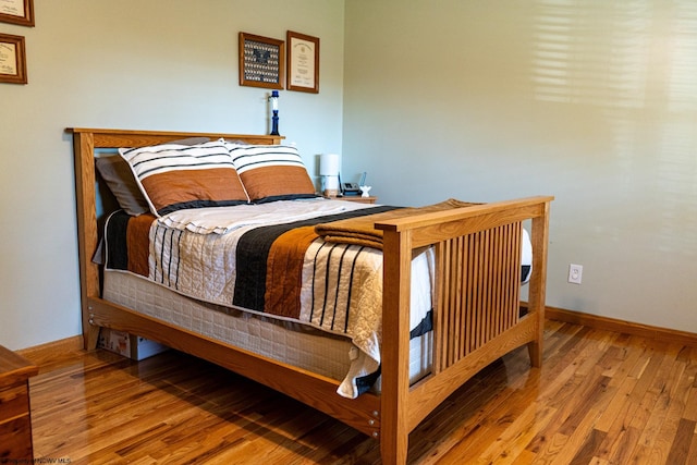 bedroom with wood-type flooring