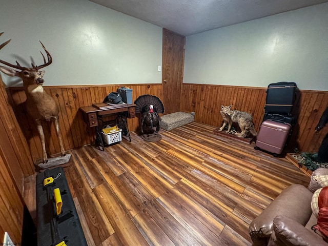 misc room featuring wood walls and dark hardwood / wood-style floors