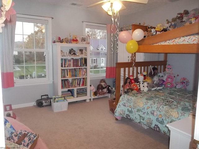 carpeted bedroom with ceiling fan