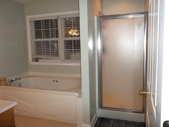 bathroom featuring vanity, tile patterned floors, and shower with separate bathtub