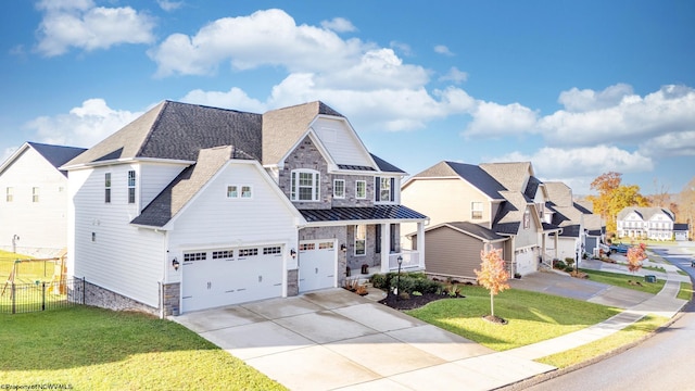 view of front of property featuring a front lawn and a garage