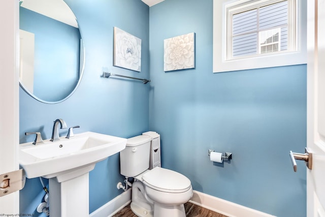 bathroom featuring toilet and hardwood / wood-style floors