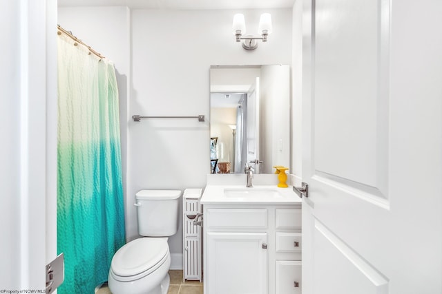 bathroom featuring vanity, toilet, and tile patterned flooring