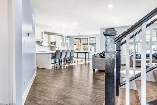 workout area featuring dark wood-type flooring