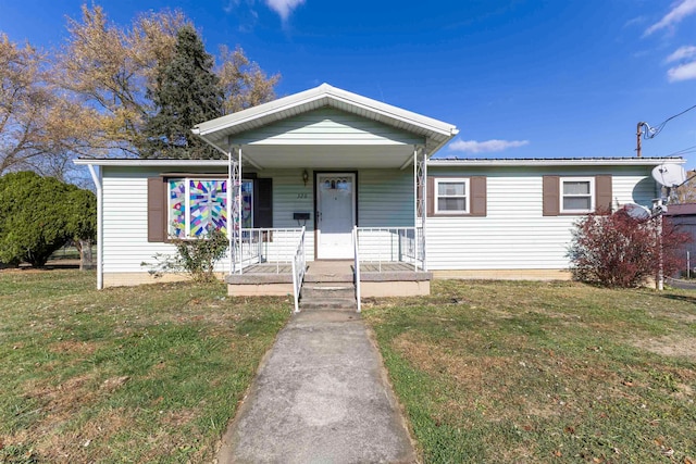 view of front of home with a front lawn and covered porch