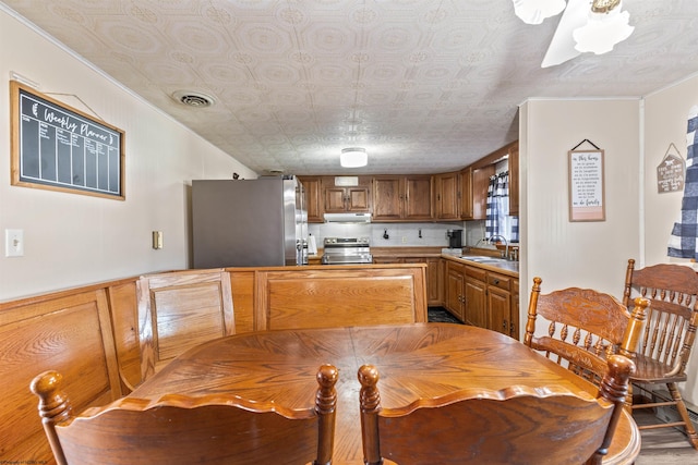 dining space featuring sink