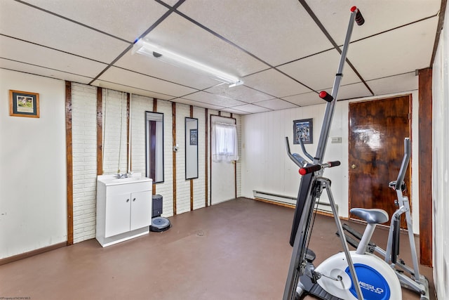 workout area featuring a drop ceiling