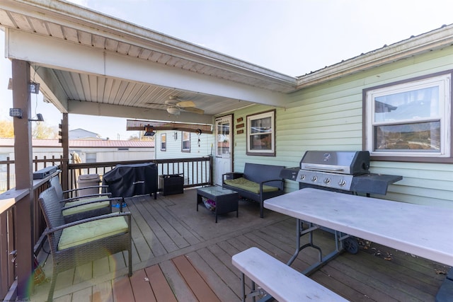 deck featuring area for grilling and ceiling fan