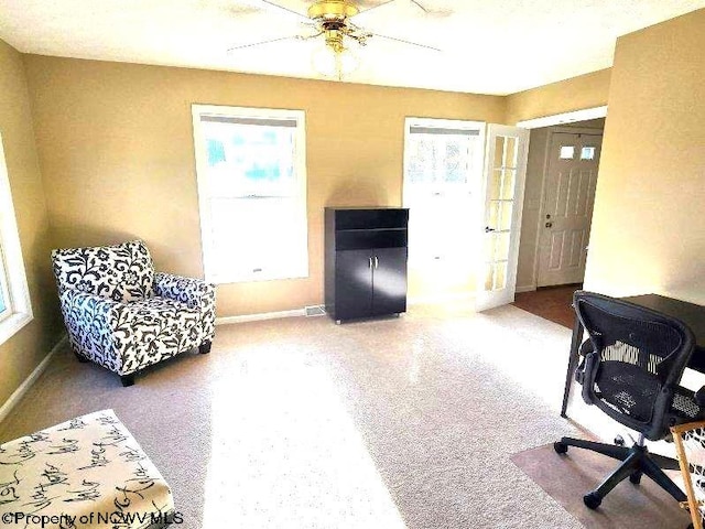 office area featuring carpet and ceiling fan