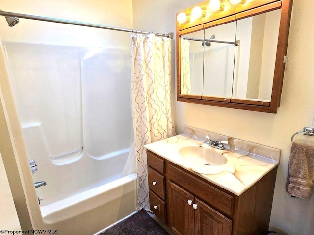 bathroom featuring vanity and shower / bathtub combination with curtain