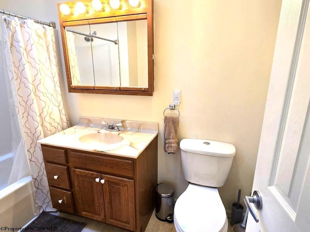 full bathroom featuring vanity, toilet, and shower / bathtub combination with curtain