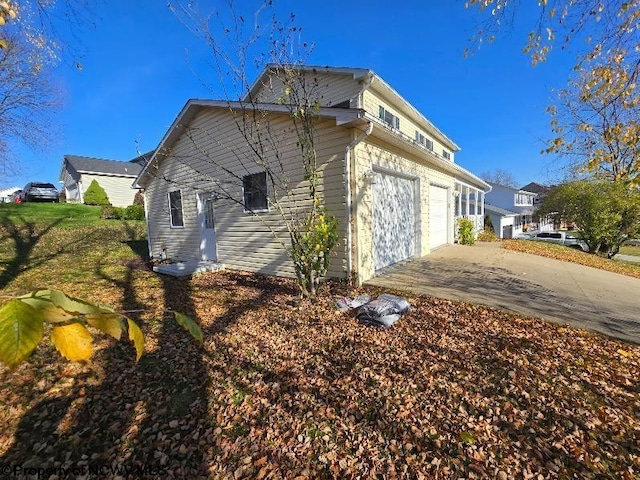 view of side of property with a garage