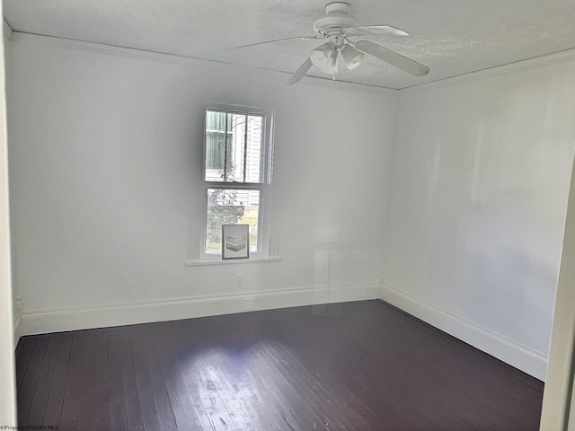 empty room with a textured ceiling, ceiling fan, and dark hardwood / wood-style flooring