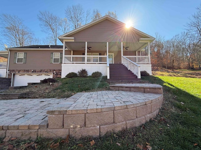 view of front facade featuring covered porch and a garage