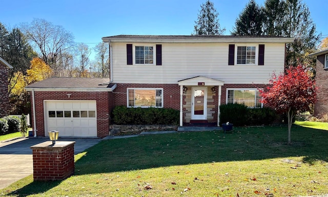 view of property featuring a front yard and a garage