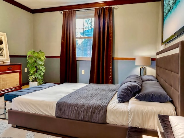 bedroom featuring crown molding