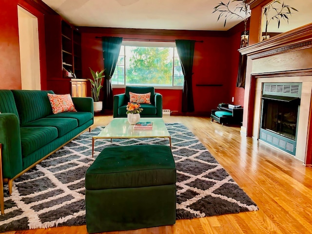 living room with hardwood / wood-style flooring and a baseboard radiator