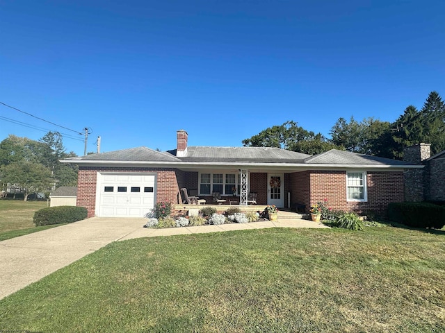 ranch-style home featuring covered porch, a front lawn, and a garage