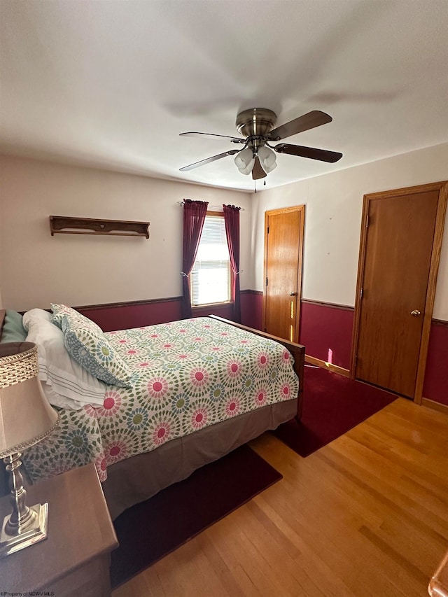 bedroom featuring ceiling fan and wood-type flooring