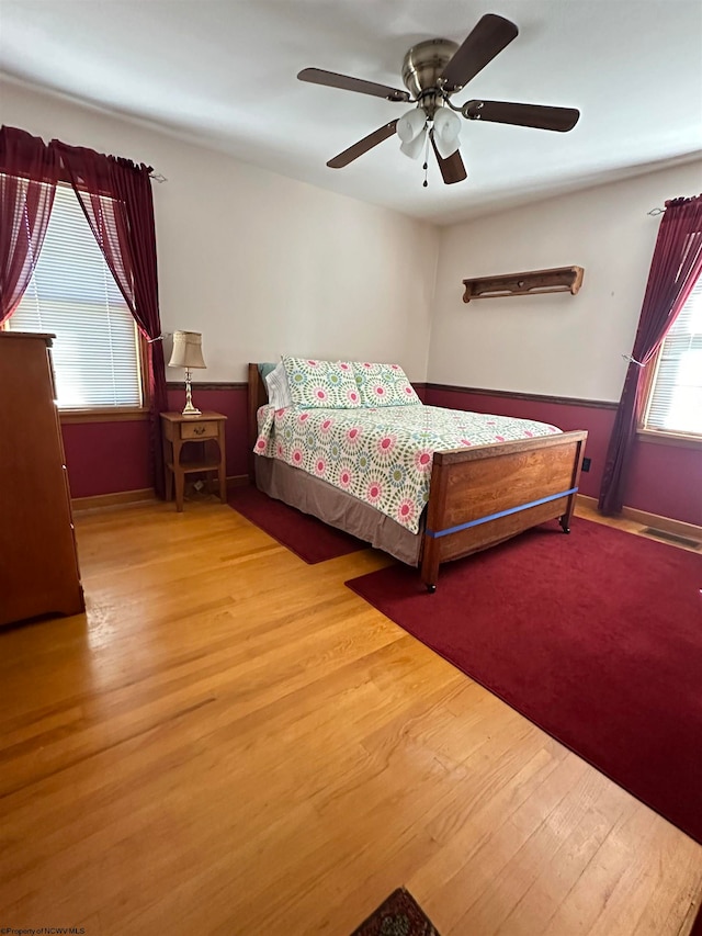 unfurnished bedroom with light hardwood / wood-style flooring and ceiling fan