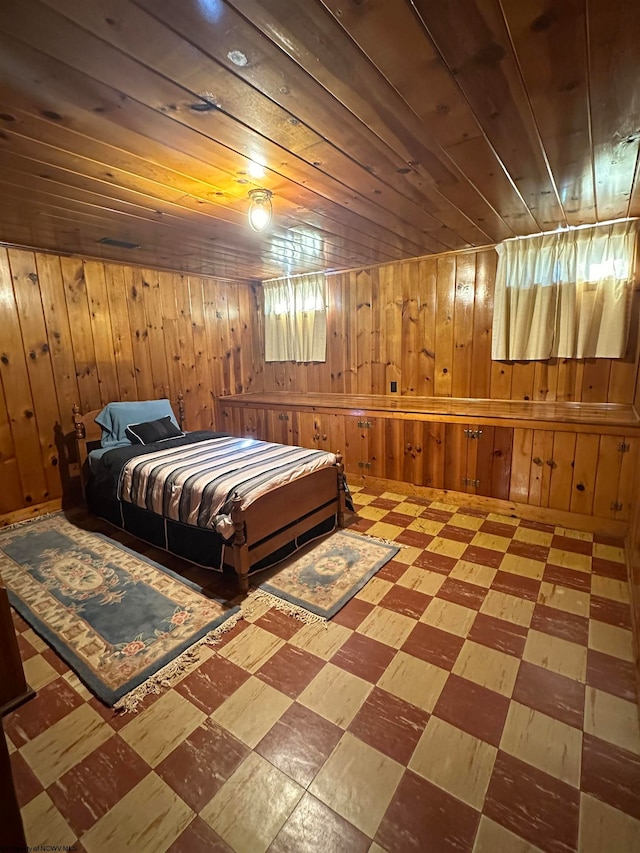 bedroom with wooden walls and wooden ceiling